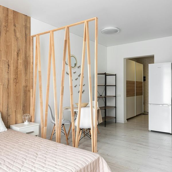 A calm, minimalist studio space with natural light and wooden floors.
